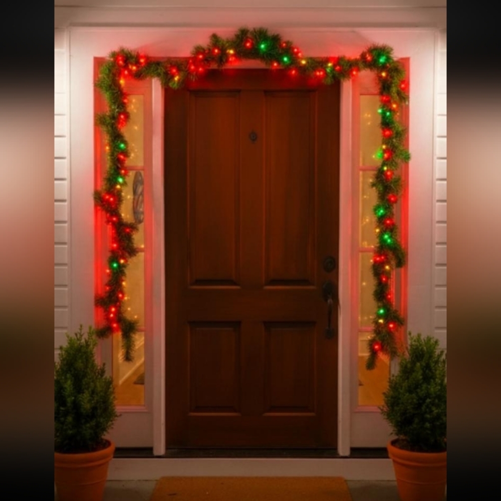 ARTIFICIAL GARLAND WITH RED, YELLOW & GREEN LIGHTS. APROXICIMETLY 150" LENGTH.